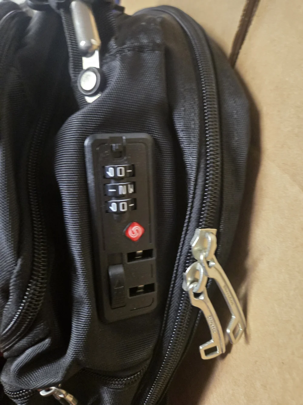 SHRRADOO travel backpack features vibrant red accents on the zippers and strap.